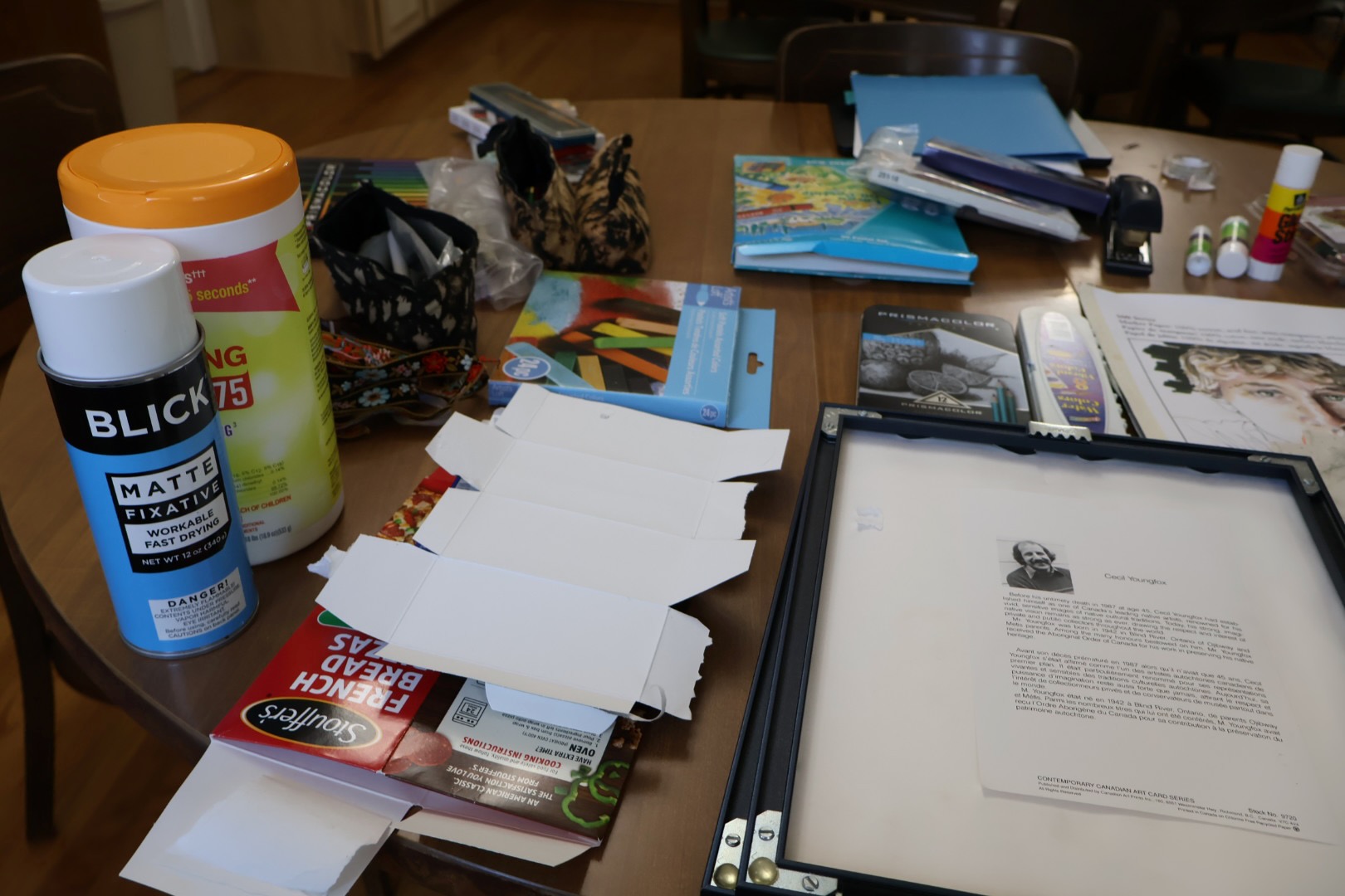 Table of art supplies to create inverted boxes
