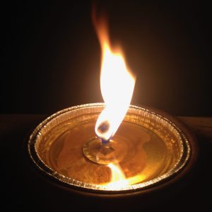 Candle lit in the dark